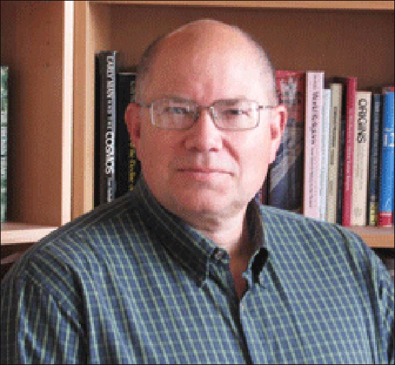 Paul Smith in front of some books. Paul Smith in front of some books.