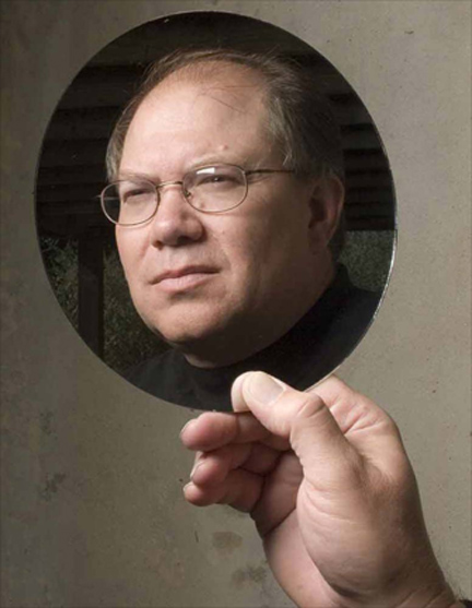 Paul H. Smith looking into a mirror.. Paul H. Smith looking into a mirror..